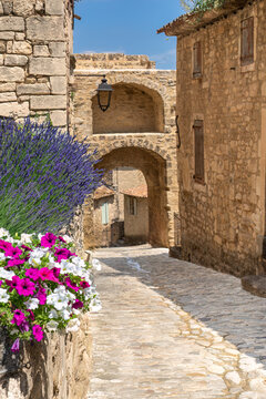Fototapeta The main street in the village of Lacoste in Provence