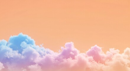 Pastel colored fluffy clouds against soft orange sky background serene dreamy scene
