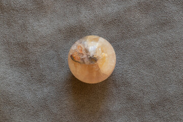 Moonstone, quartz on table on gray velour fabric for collection and interior