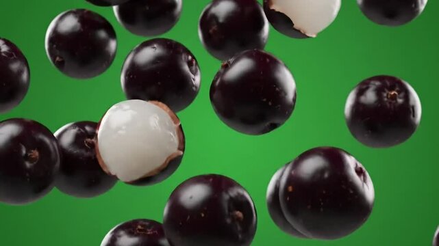 Falling Jabuticaba and Lychee Fruits Against a Vibrant Green Background