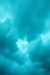 Dramatic turquoise sky featuring dynamic cloud formations and soft light