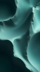 Subtle teal tones of an undulating abstract textile creation, soft shadows