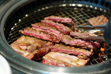 Korean BBQ with Raw Beef Short Ribs Grilled on Charcoal at Local Galbi Restaurant