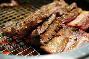 Korean BBQ with Raw Beef Short Ribs Grilled on Charcoal at Local Galbi Restaurant