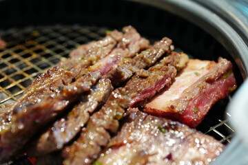 Korean BBQ with Raw Beef Short Ribs Grilled on Charcoal at Local Galbi Restaurant