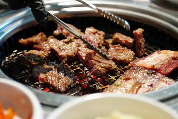 Korean BBQ with Raw Beef Short Ribs Grilled on Charcoal at Local Galbi Restaurant