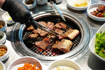 Korean BBQ with Raw Beef Short Ribs Grilled on Charcoal at Local Galbi Restaurant