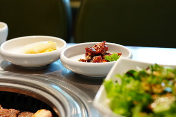Korean BBQ with Raw Beef Short Ribs Grilled on Charcoal at Local Galbi Restaurant