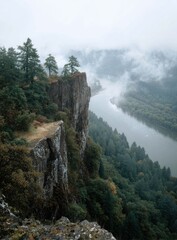 Misty river valley, cliffside vista