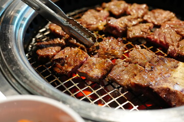 Korean BBQ with Raw Beef Short Ribs Grilled on Charcoal at Local Galbi Restaurant