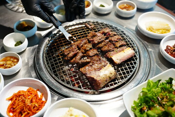 Korean BBQ with Raw Beef Short Ribs Grilled on Charcoal at Local Galbi Restaurant