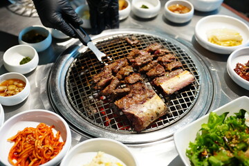 Korean BBQ with Raw Beef Short Ribs Grilled on Charcoal at Local Galbi Restaurant