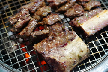 Korean BBQ with Raw Beef Short Ribs Grilled on Charcoal at Local Galbi Restaurant