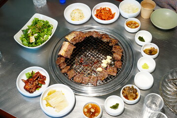 Korean BBQ with Raw Beef Short Ribs Grilled on Charcoal at Local Galbi Restaurant