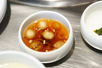 Korean BBQ with Raw Beef Short Ribs Grilled on Charcoal at Local Galbi Restaurant