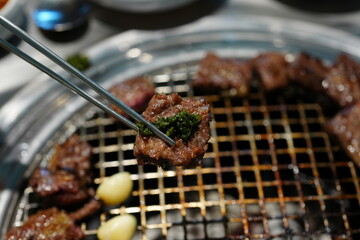 Korean BBQ with Raw Beef Short Ribs Grilled on Charcoal at Local Galbi Restaurant