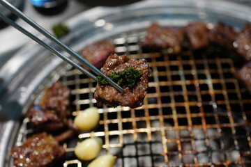 Korean BBQ with Raw Beef Short Ribs Grilled on Charcoal at Local Galbi Restaurant