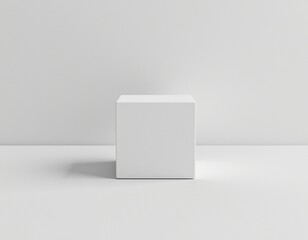 a bright, white, three dimensional cube is the central subject of the image, the cube sits on a flat surface that mirrors the plain backdrop, both of which are an off white hue