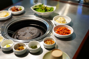 Korean BBQ with Raw Beef Short Ribs Grilled on Charcoal at Local Galbi Restaurant