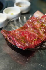 Korean BBQ with Raw Beef Short Ribs Grilled on Charcoal at Local Galbi Restaurant