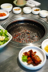 Korean BBQ with Raw Beef Short Ribs Grilled on Charcoal at Local Galbi Restaurant