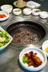 Korean BBQ with Raw Beef Short Ribs Grilled on Charcoal at Local Galbi Restaurant
