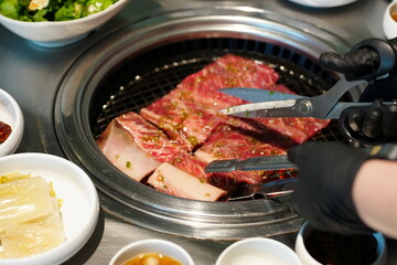 Korean BBQ with Raw Beef Short Ribs Grilled on Charcoal at Local Galbi Restaurant
