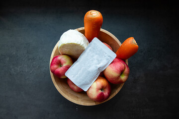 Fresh Produce Apples, Carrots, and Dairy Product in a Wooden Bowl