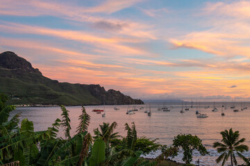 Taiohae Bay at sunset with sailboats in Nuku Hiva, Marquesas Islands, French Polynesia