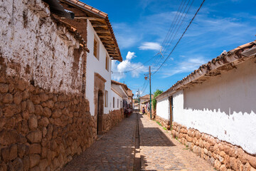 Traditional cobbled streets in Chinchero, Peru, with white adobe walls