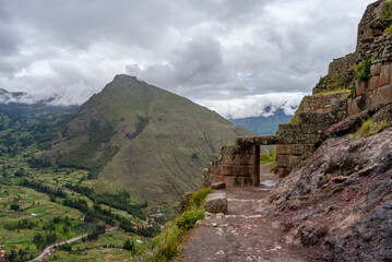 Ancient Inca ruins of Pisac nestled in the Andean mountains, Peru