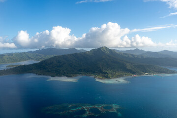 Aerial view of Tahaa island, French Polynesia, with turquoise lagoon and reef