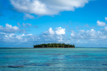 Idyllic motu on Tikehau Atoll, French Polynesia, surrounded by turquoise waters