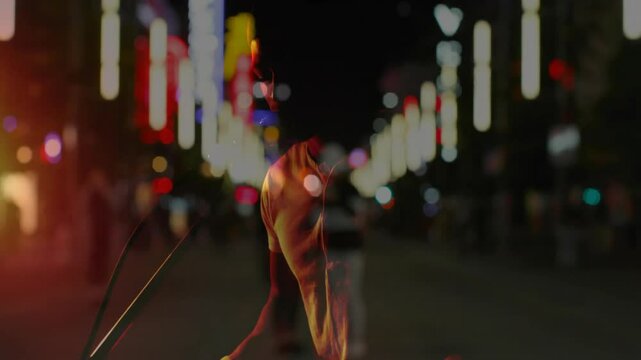 Man reaching toward keyboard playing chords singing into headset mic in neon lit street music