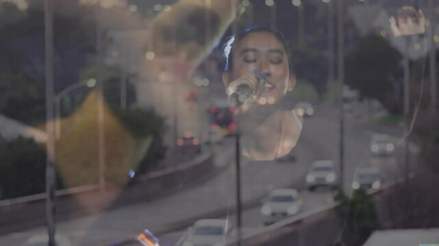 Highway opening overlaying singer performing into mic with musician mixing controls for music show