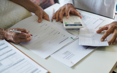 retired adult asian female reading life insurance policy, life insurance agent advice to customer...
