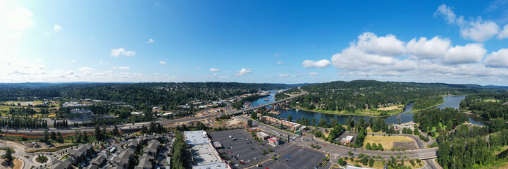 Aerial drone picture of Abernethy Bridge and I-205 highway over the Willamette River, connecting Oregon City and West Linn, Oregon, with construction barges, traffic, and scenic surroundings	

