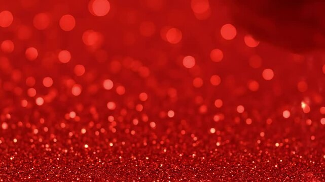 Red glitter background with blurred bokeh lights depth of field effect
