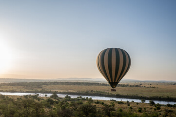 Hot air balloon safari over Mara River in Serengeti National Park, Tanzania during Great Migration