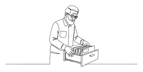 man organizing documents in office drawer