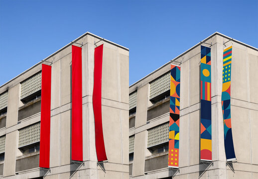 Outdoor advertising mockup showcases three vertical red fly banners on a building in Spain