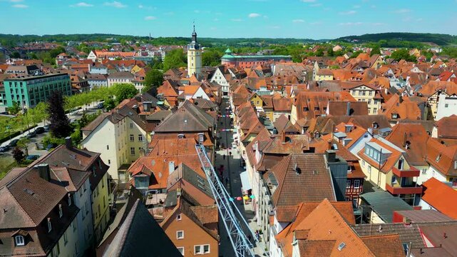 4K Aerial Drone Video of the Historic Herrieder Clock Tower in the Old Town area of Downtown Ansbach, Germany