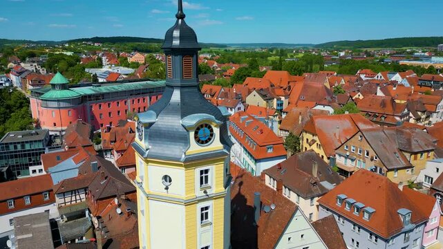 4K Aerial Drone Video of the Historic Herrieder Clock Tower in the Old Town area of Downtown Ansbach, Germany