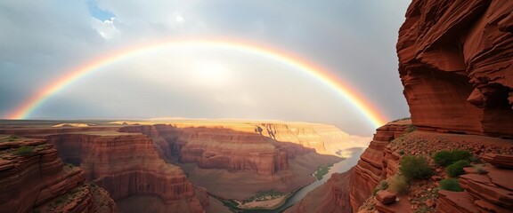 Vibrant rainbow arcing over a canyon, river meandering below,  travel,  wilderness