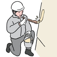 ハケを使って作業する作業員_カラー