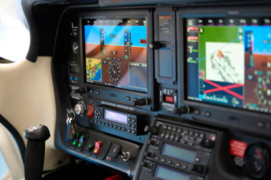 Modern aircraft cockpit control panel showing flight data and navigation information