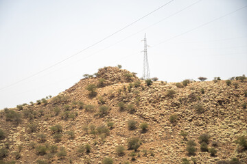 High voltage power lines running along the top of a hill outside of Massawa, Eritrea