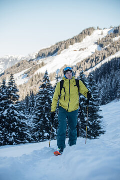 Man ski touring in Kitzb&uuml;hel Austrian snowy mountains