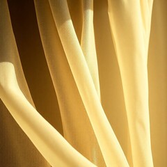 A close-up shot of delicate soft chiffon fabric with a cast bronze surface, intense dramatic lighting, and antique patina finish, emphasizing high contrast and texture.