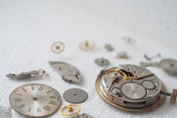 disassembled the clock on a white background